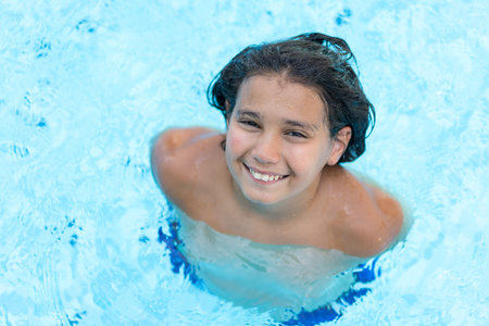 Children enjoying in summer resort at pool