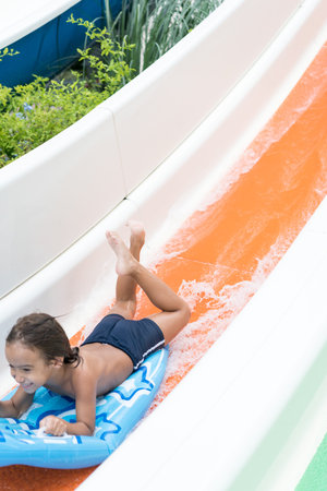 Children enjoying in summer resort at pool with air mattressの写真素材