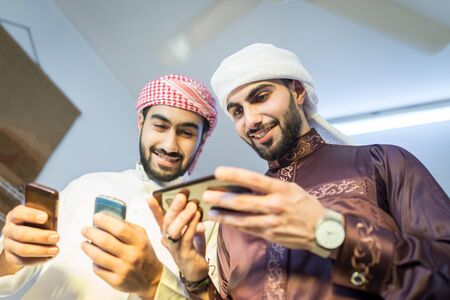 Arab guy with smart phoneの写真素材