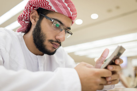 Middle eastern boys with smart phoneの写真素材