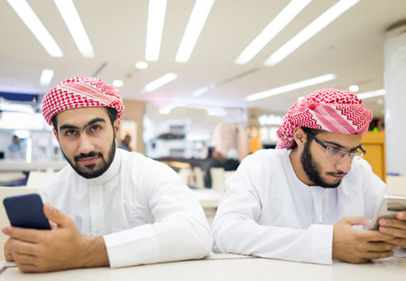 Middle eastern young men with smart phone