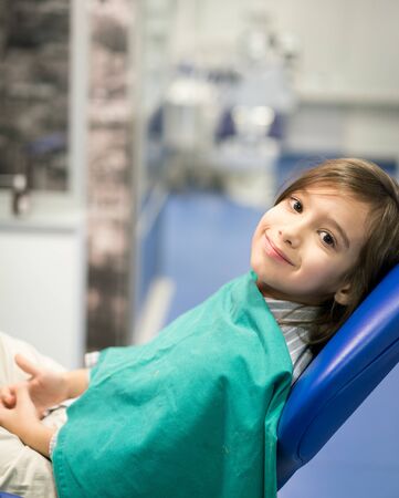 Young Smiling Boy Posing Before Regular Dental Check Up in Clinicの写真素材