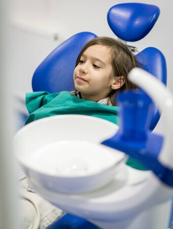 Young Smiling Boy Posing Before Regular Dental Check Up in Clinicの写真素材