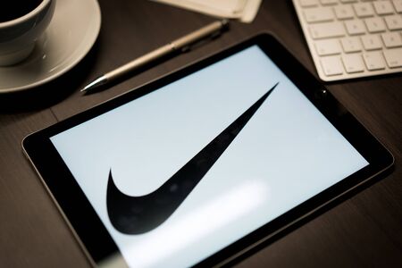 New York, New York / USA - 11 11 2019: Logo of Nike on the iPad Air2 in on office deskのeditorial素材