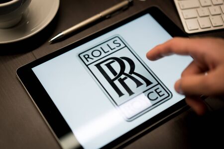 New York, New York / USA - 11 11 2019: Logo of Rolls Royce on the iPad Air2 in on office deskのeditorial素材