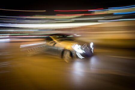 Cars motion on city rain night streetの写真素材