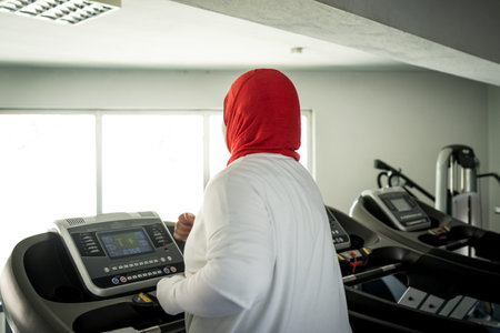 Arabic woman active working out in gym