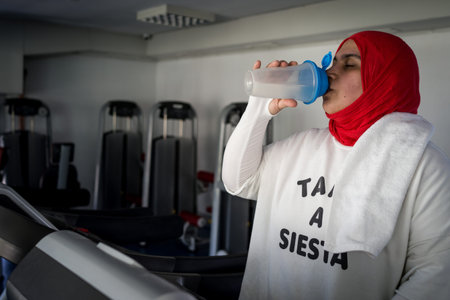Arabic woman active working out in gym