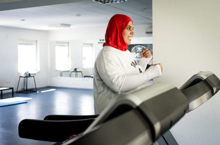Arabic woman active working out in gym