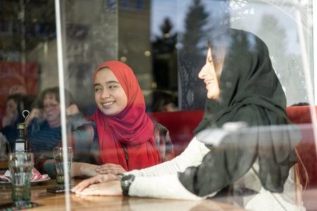 Female friends having lunch together in restaurant