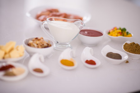 Preparing food in modern white kitchenの写真素材