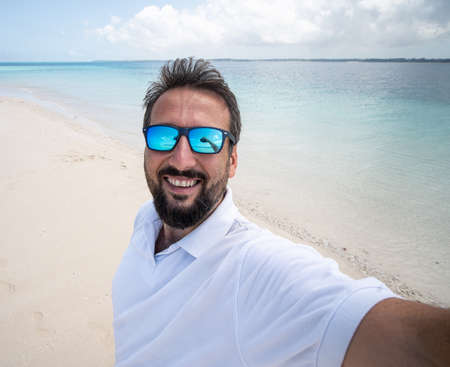 One man is enjoying beautiful tropical beachの写真素材