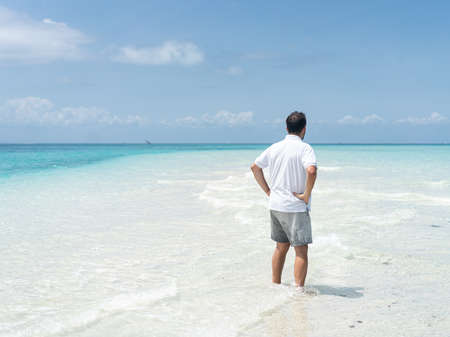 One man is enjoying beautiful tropical beachの写真素材