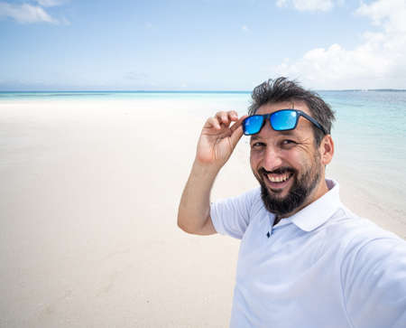 One man is enjoying beautiful tropical beachの写真素材