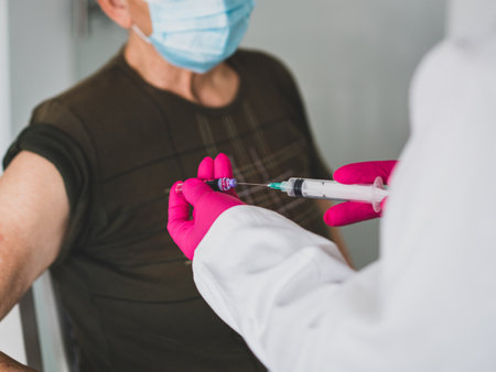 Senior old woman in hospital getting vaccine 2021の写真素材