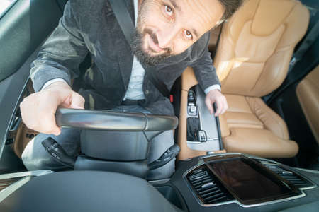 Man driving car taking selfie from above upの写真素材