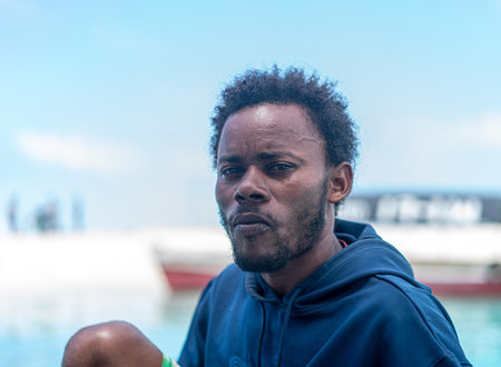 Young black man working on a coastの写真素材