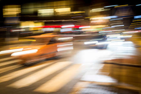 Cars motion on the city rain night streetの写真素材