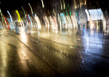 Cars motion on the city rain night streetの写真素材