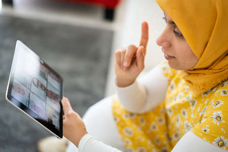 Middle Eastern businesswoman having the online conferenceの写真素材