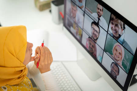 Middle Eastern businesswoman having the online conferenceの写真素材