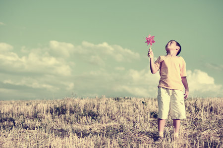 Happy kid on beautiful fieldの写真素材