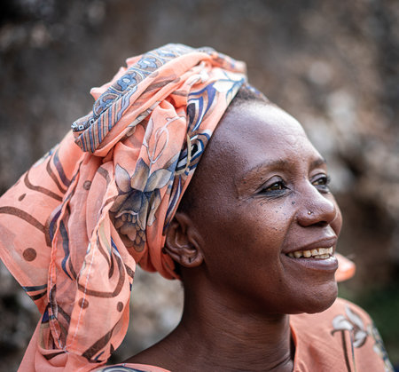 Black African senior beautiful woman with scarf outdoorsの写真素材