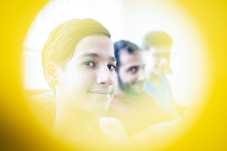 Boy smiling looking into cameraの写真素材