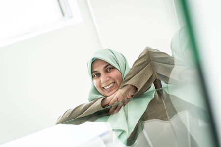 Low angle of a Muslim Arabic woman indoors