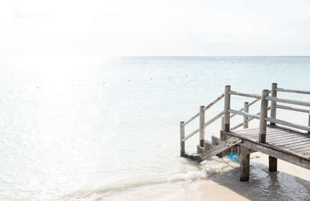 Beautiful tropical steps into turquoise sea waterの写真素材
