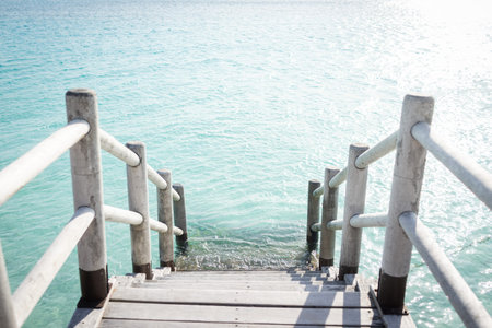 Beautiful tropical steps into turquoise sea water
