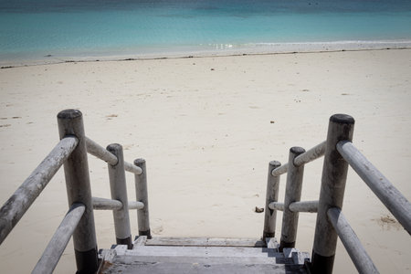 Beautiful tropical steps into turquoise sea waterの写真素材