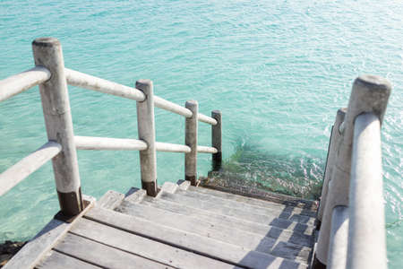 Beautiful tropical steps into turquoise sea waterの写真素材