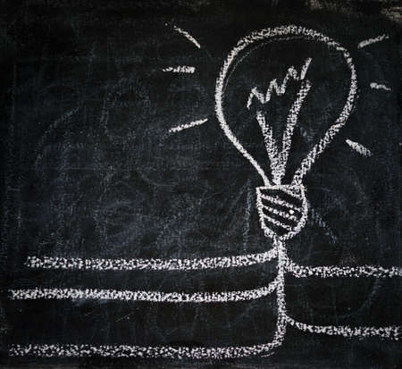 Smart bulb of best idea solution on boardの写真素材