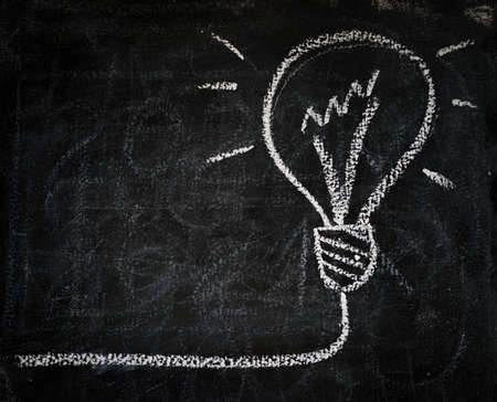 Smart bulb of best idea solution on boardの写真素材
