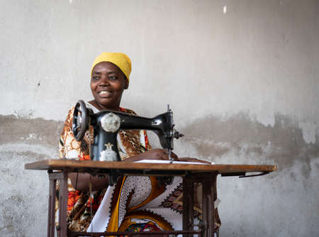 African female tailor working on sewing machineの写真素材