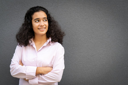 One positive person portrait against grey wall