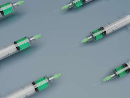 syringes with multicolored liquid on a background. High quality photoの写真素材