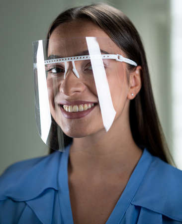 Beautiful young woman with mask inside hospital, high quality photoの写真素材