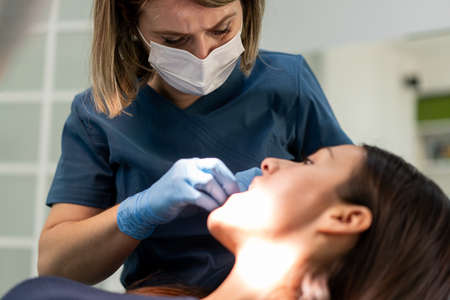 Visiting friendly and professional dentist. High quality photoの写真素材