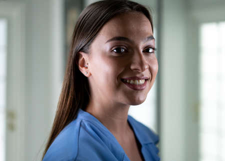 Beautiful young woman with mask inside hospital, high quality photoの写真素材