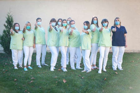 Nursing female team together portrait out side . high quality photoの写真素材