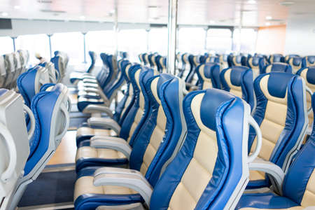 Ferry over ocean. Interior of a ship with empty passengers seats and sea view. High quality photoの写真素材