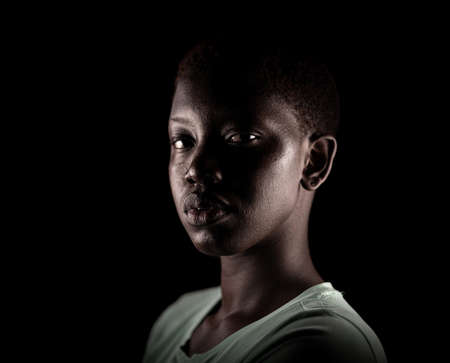 Beauty face. Smiling woman portrait. Beautiful candid real face African American girl High quality photoの写真素材