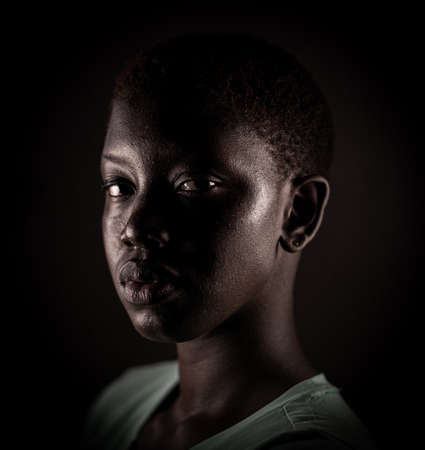 Beauty face. Smiling woman portrait. Beautiful candid real face African American girl High quality photoの写真素材
