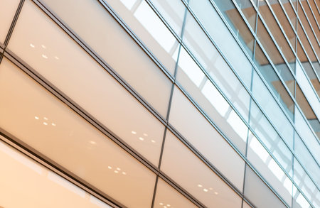 Modern building facade pattern with reflecting in windows. High quality photo