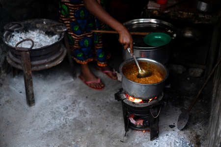 Women cooking traditional food outdoors in the street. High quality photoの写真素材