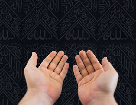 Muslim pilgrims in white traditional clothes, praying at Kaaba in Makkah. High quality photoの写真素材