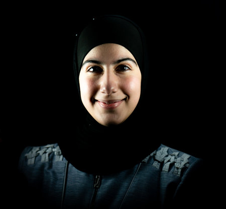 Attractive Muslim woman on black background. High quality photoの写真素材