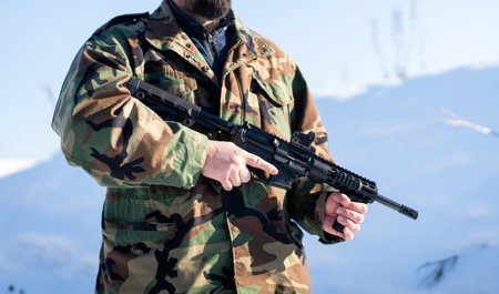 Male Soldier In Military Uniform On Winter Snow. High quality photoの写真素材